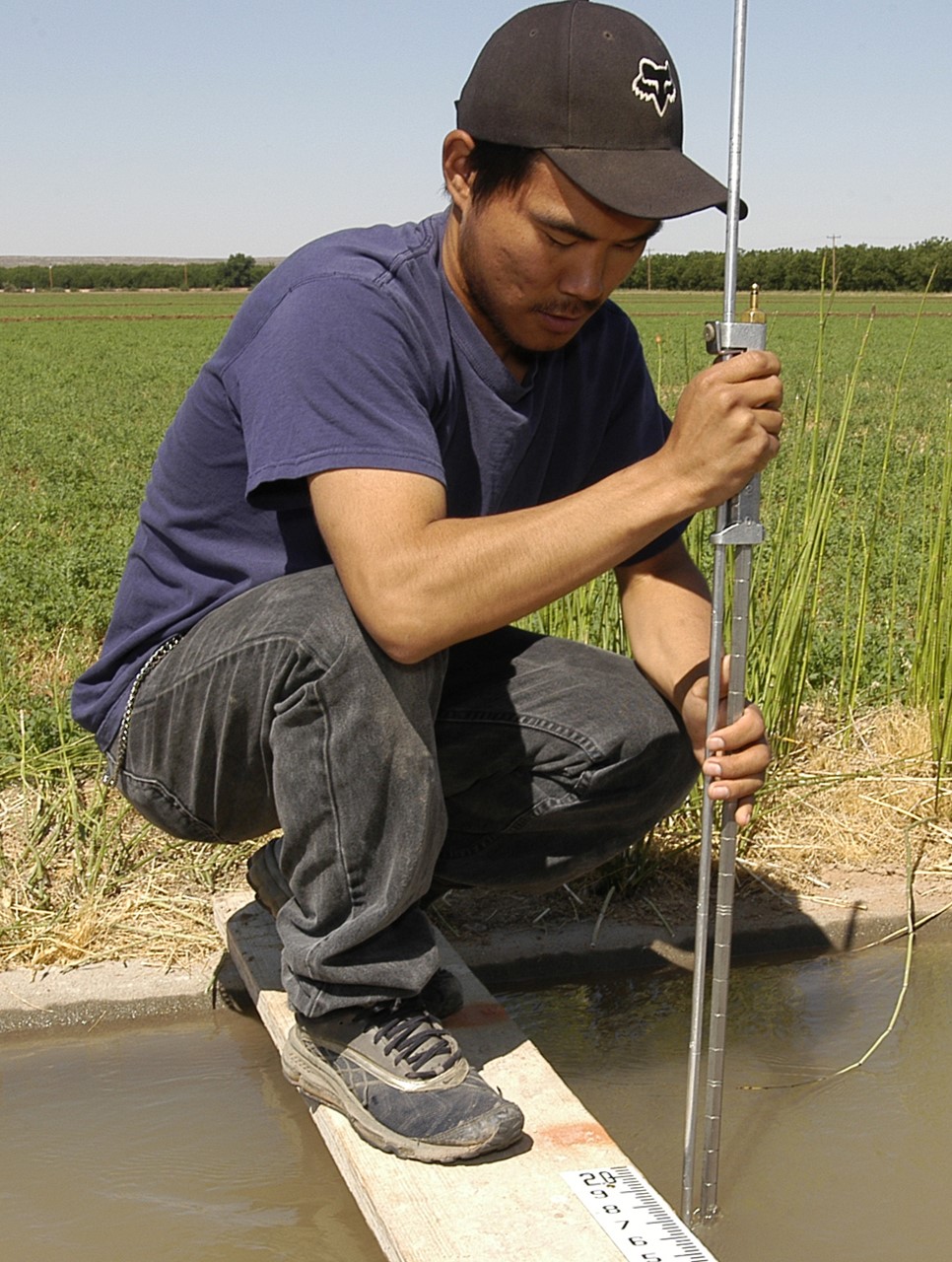 Student taking water samples